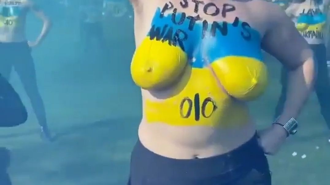 Topless feminist against war