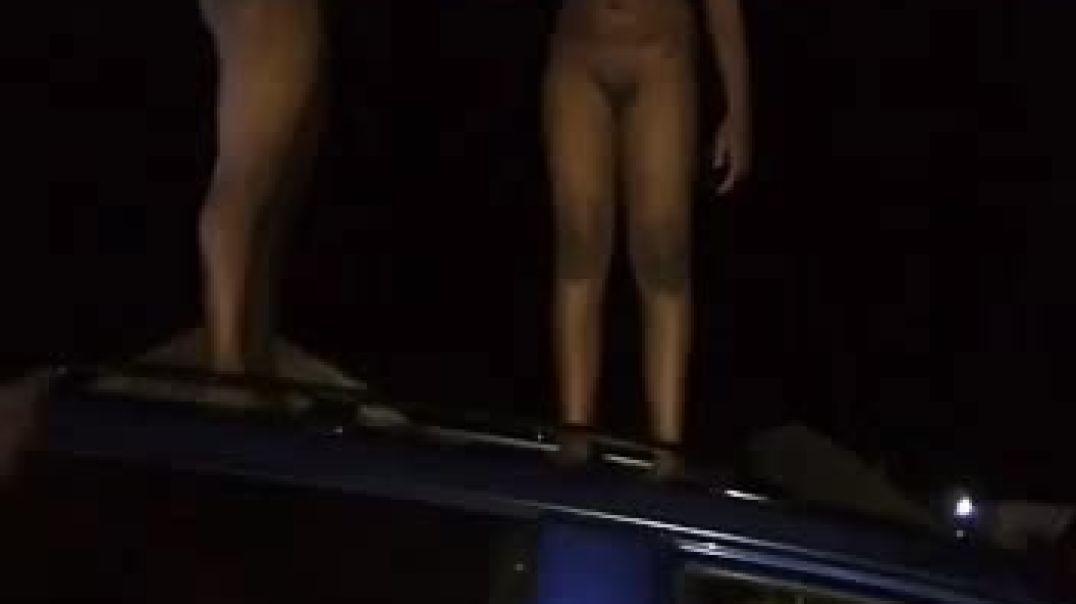 ⁣Ladies dancing and playing with pussy  while standing on car